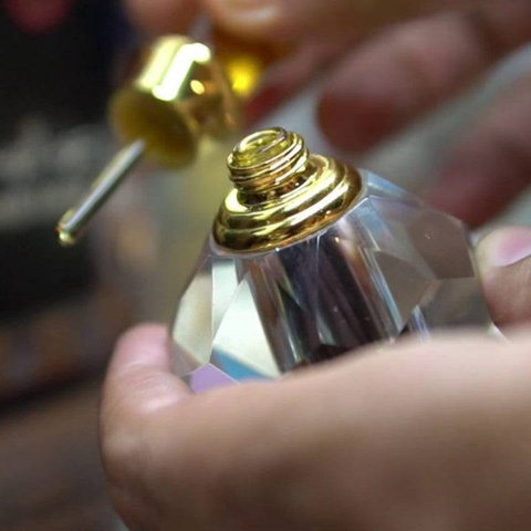 Ajmal Dahn Al Oudh Moattaq concentrated perfume oil in a 6ml bottle, featuring rich, traditional oud fragrance in a sleek container.