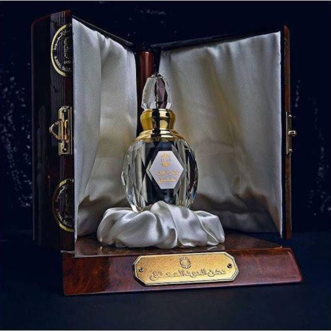 Ajmal Dahn Al Oudh Moattaq unisex concentrated perfume oil bottle, 6ml, with elegant packaging and a rich, luxurious fragrance.