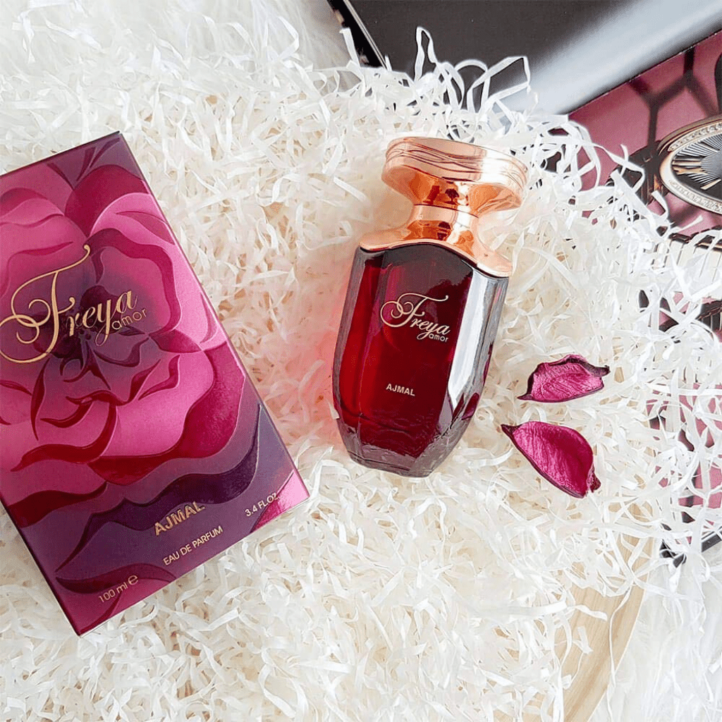 Ajmal Freya Amor Eau De Parfum spray bottle for women, 100 ML, featuring elegant packaging and nozzle design.