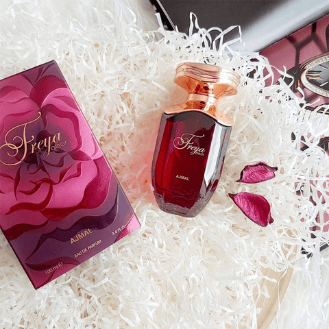 Ajmal Freya Amor Eau De Parfum spray bottle for women, 100 ML, featuring elegant packaging and nozzle design.