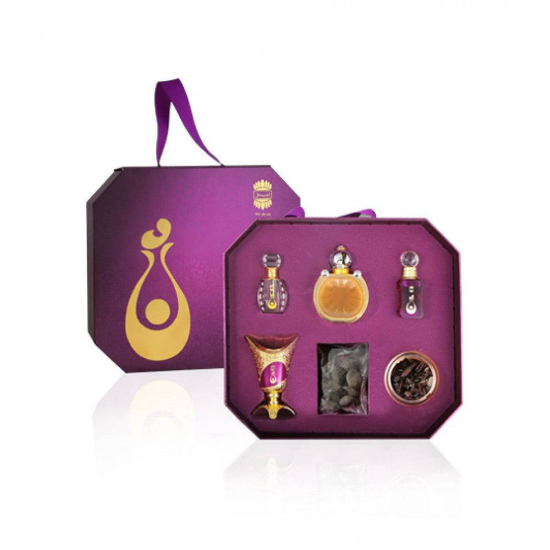 Ajmal Mother's Day perfume gift set with floral bottles and elegant packaging, perfect for a special celebration.