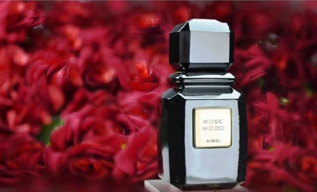 Ajmal Rose Wood Eau De Parfum 100ml bottle with rose and woody scent, elegant glass perfume bottle.