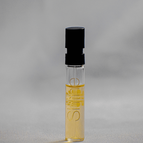 Ajmal Shine EDP sample for women in a 1ml vial, showcasing the fragrance packaging with a sleek, clear design.