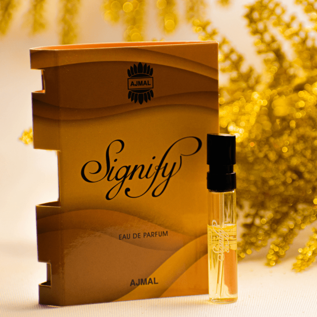 Ajmal Signify EDP sample for women in a clear 1ml vial, showcasing the small perfume sample for testing or gifting.