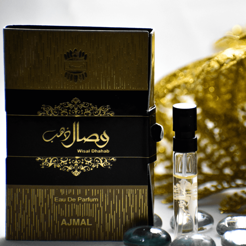 Ajmal Wisal Dhahab unisex EDP sample bottle, 1ml size, with elegant packaging and fragrance details visible in the image.