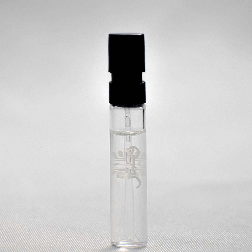 Ajmal Wisal EDP sample for women in a 1ml vial with white cap, showcasing the fragrance bottle and packaging.