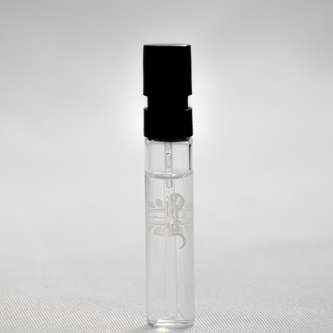 Ajmal Wisal EDP sample for women in a 1ml vial with white cap, showcasing the fragrance bottle and packaging.