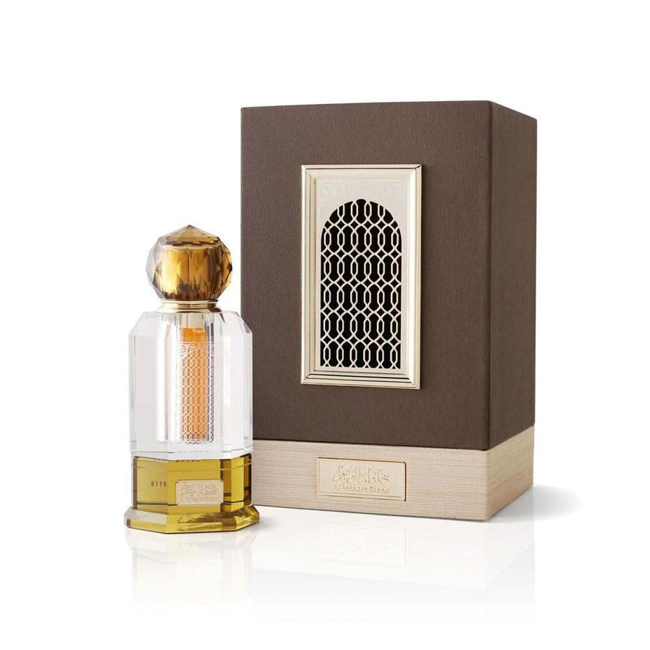 Al Wisam Blend concentrated perfume oil by Abdul Samad Al Qurashi in a 12ml bottle, featuring a clear glass container with a gold cap.