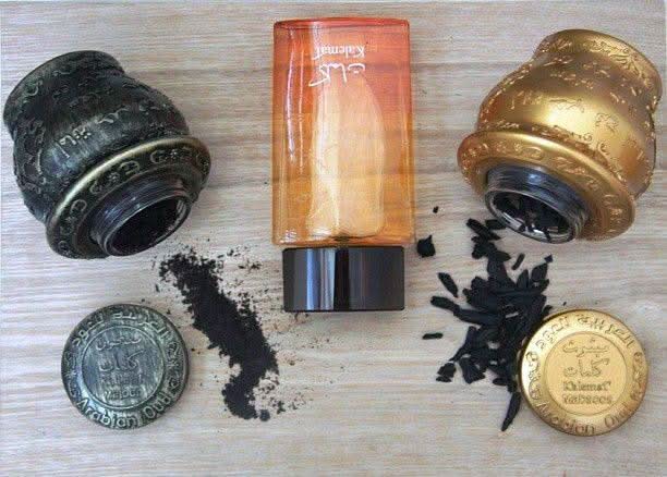 Arabian Oud Kalemat perfume gift set with two 100ml EDP bottles, featuring elegant packaging and intricate design elements.
