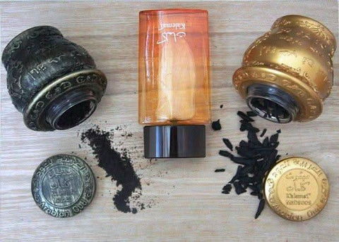 Arabian Oud Kalemat perfume gift set with two 100ml EDP bottles, featuring elegant packaging and intricate design elements.