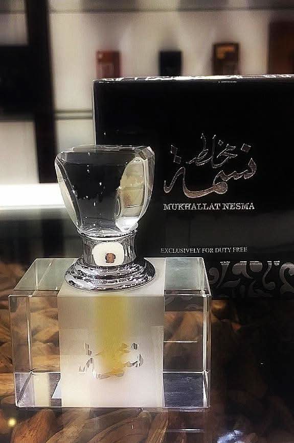 Arabian Oud Mukhallat Nesma perfume oil for women, 6ml, concentrated perfume oil with floral and oriental fragrance, in a small glass bottle.
