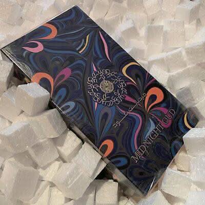 Ard Al Zaafaran Midnight Oud Eau de Parfum spray 100ml bottle, dark glass with a sleek design and aromatic fragrance label.