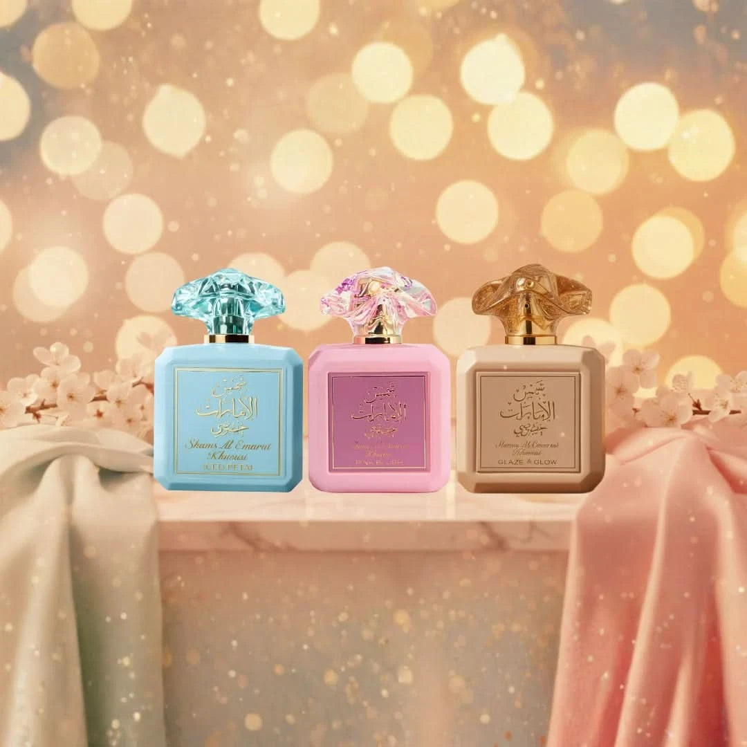 Bundle of Ard Al Zaafaran Shams Al Emarat Pink Blush, Glaze & Glow, Iced Petal Eau de Parfum sprays in 100ml bottles, with colorful perfume bottles.