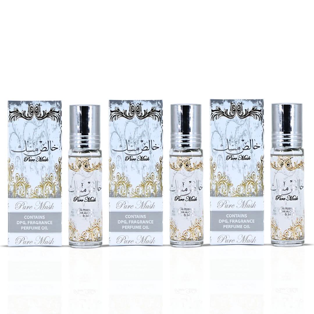Set of three Ard Al Zaafaran Pure Musk concentrated perfume oils in 10ml bottles, featuring elegant packaging and clear branding.