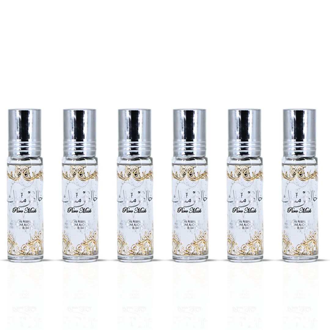 Six bottles of Ard Al Zaafaran Pure Musk roll-on perfume oil, 10ml each, featuring concentrated musk fragrance in sleek packaging.