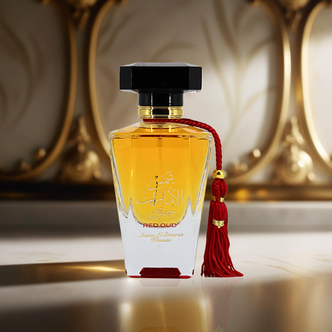 Red Oud Shams Al Emarat Khususi Eau de Parfum spray in 100ml by Ard Al Zaafaran, displayed in a velvet pouch.
