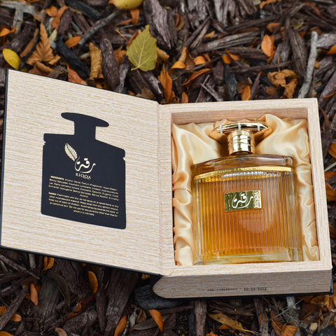 Riqqa Eau de Parfum Spray by Ard Al Zaafaran, 100ml bottle, elegant glass bottle with floral and spicy fragrance details.
