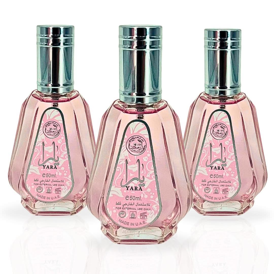 Three bottles of Ard Al Zaafaran Yara Eau de Parfum Spray 50ml, elegant glass bottles with floral and fruity fragrance accents.