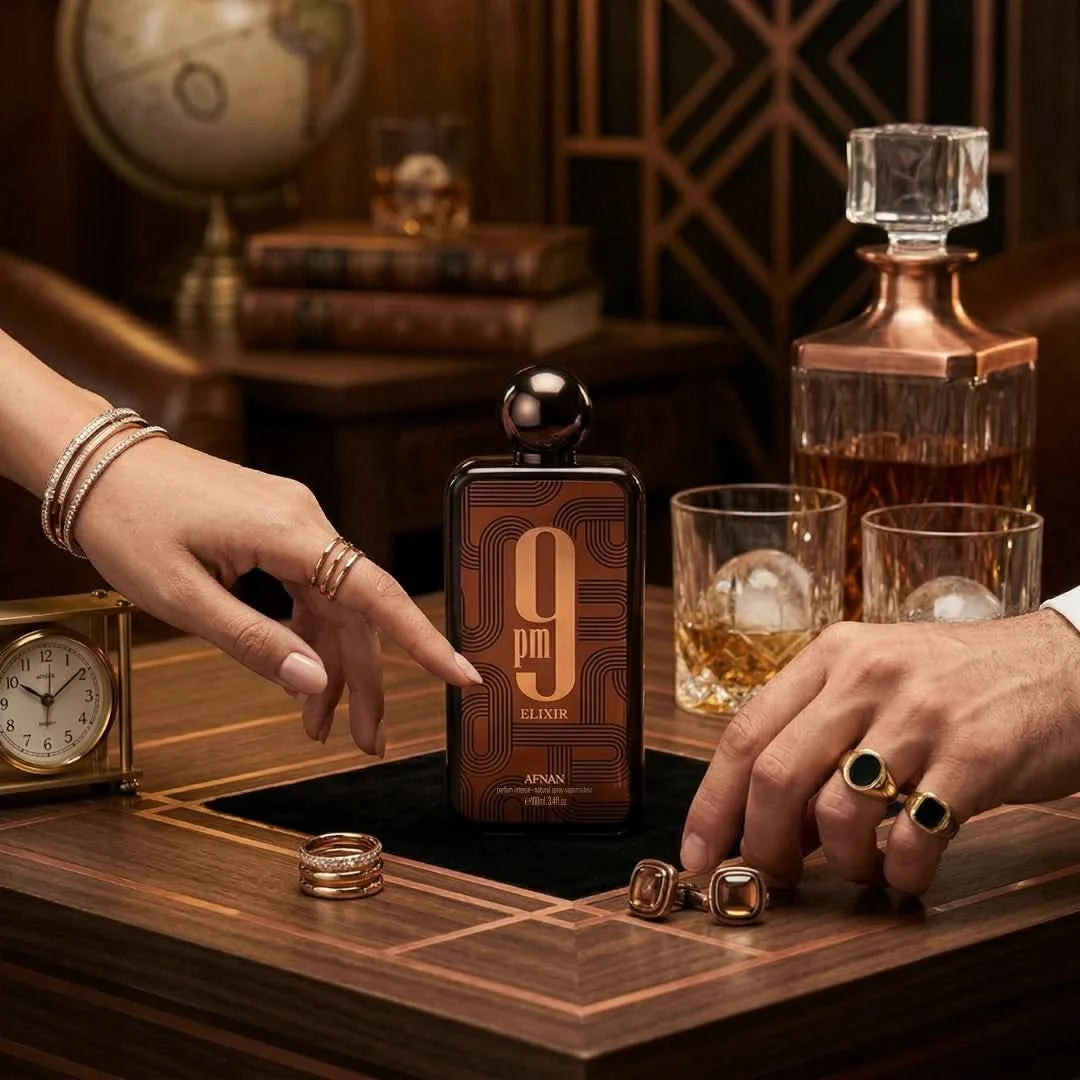 Afnan 9PM Elixir Eau De Parfum spray 100ml bottle, elegant glass container with gold accents, showcasing luxurious fragrance.