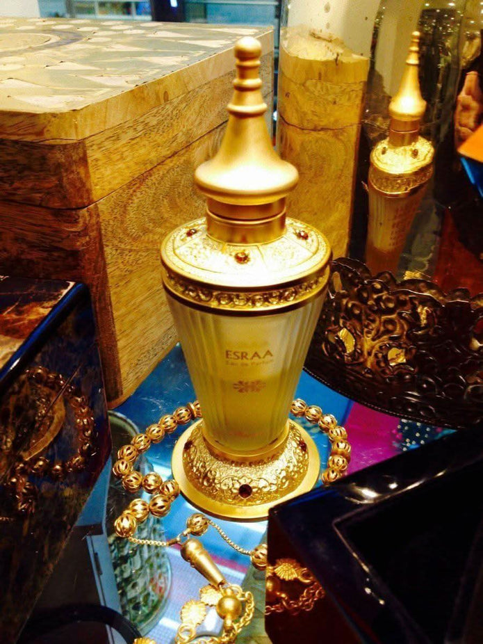 Rasasi Esraa CPO concentrated perfume oil in a 30ML bottle with elegant packaging and a sleek, dark-colored design.
