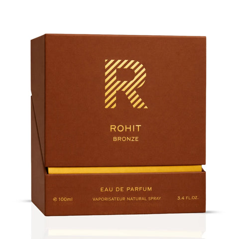 Rohit Bronze Eau de Parfum spray by Bharara, 100ml bottle, elegant bronze-colored perfume bottle with a sleek design.