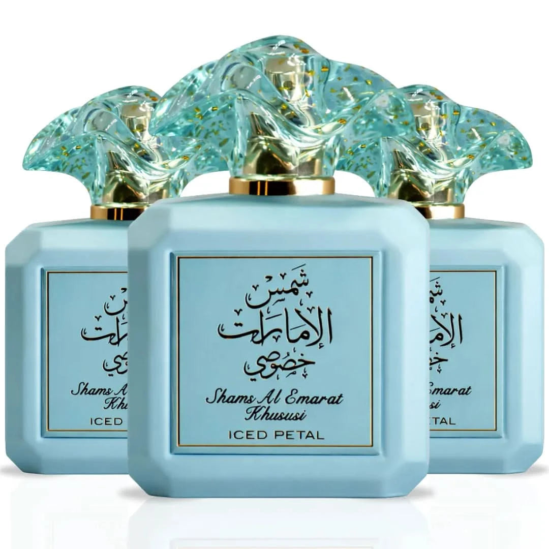 Three 100ml Ard Al Zaafaran Shams Al Emarat Khususi Iced Petal Eau De Parfum sprays arranged together.