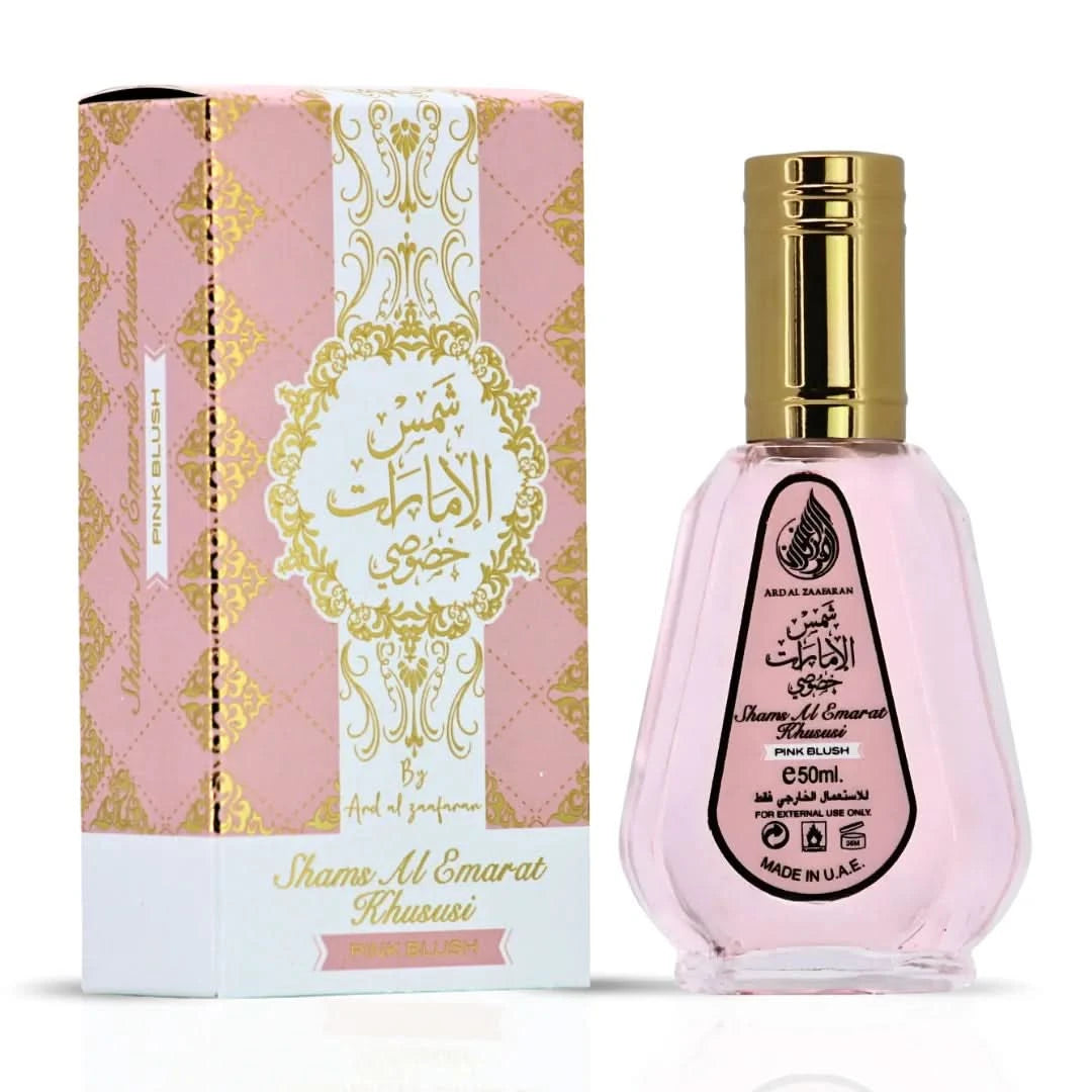 Ard Al Zaafaran Pink Blush Shams Al Emarat perfume bundle with 10ml roll-on oil and 50ml Eau de Parfum spray, featuring floral pink accents.