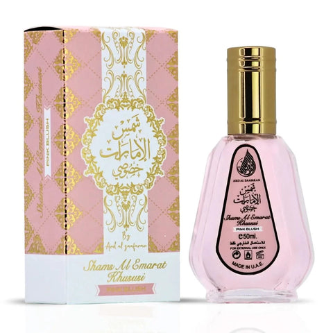 Ard Al Zaafaran Pink Blush Shams Al Emarat perfume bundle with 10ml roll-on oil and 50ml Eau de Parfum spray, featuring floral pink accents.