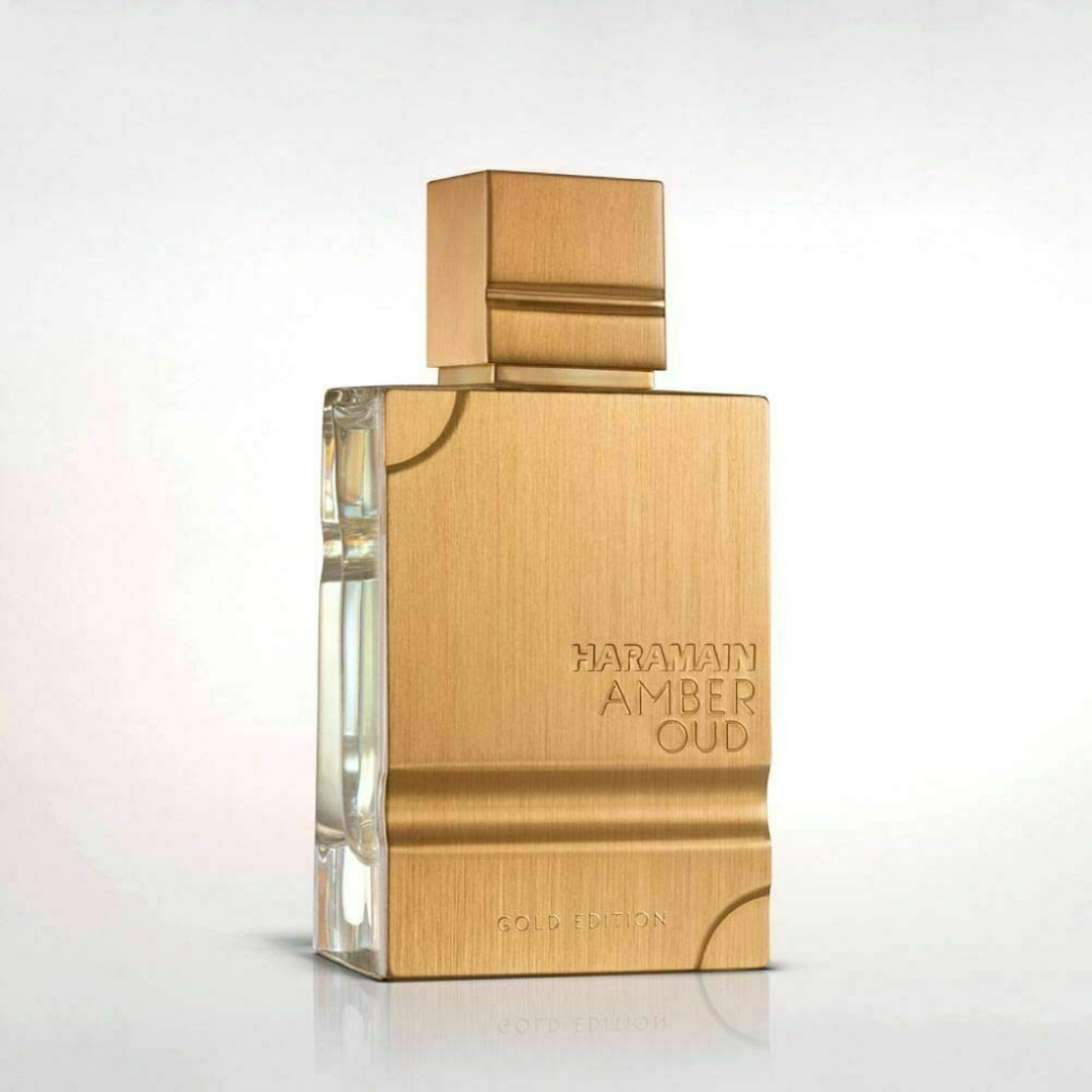 Al Haramain Amber Oud Gold Edition Eau de Parfum spray in a sleek gold bottle, 100ml, with velvet pouch.