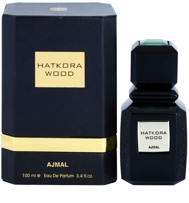 Ajmal Hatkora Wood Eau De Parfum bottle, 100 mL, with a sleek glass design and a black cap, showcasing the fragrance packaging.