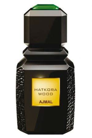 Ajmal Hatkora Wood Eau De Parfum 100 mL bottle, featuring a sleek design and amber-colored liquid in a luxurious glass container.