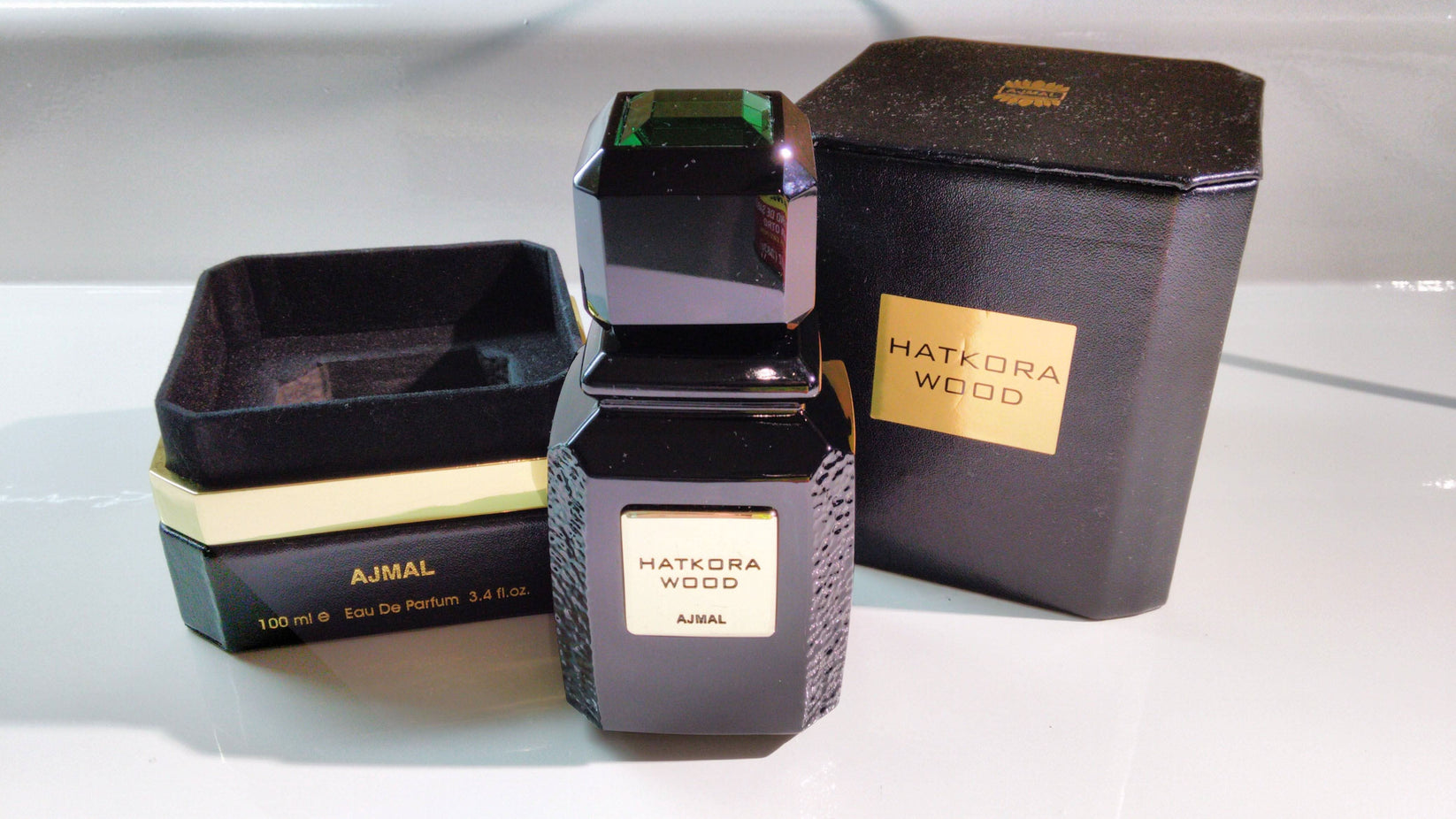 Ajmal Hatkora Wood Eau De Parfum 100 mL bottle with elegant packaging, showcasing the fragrance's sophisticated design.