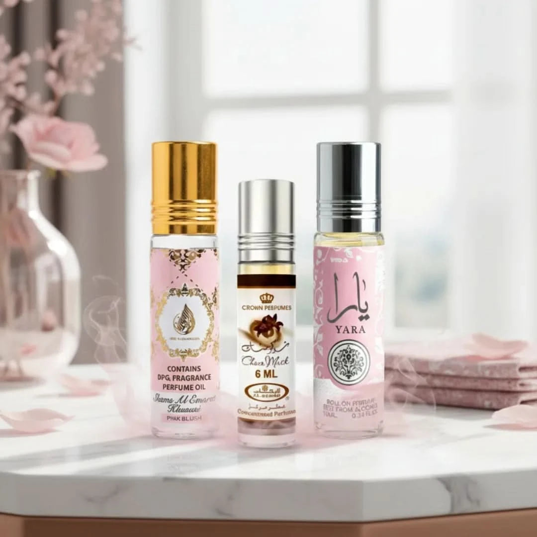 Bundle of Pink Blush & Yara roll-on perfume oils by Ard Al Zaafaran and Choco Musk Marshmallow oil by Al Rehab, in 10ml and 6ml bottles.