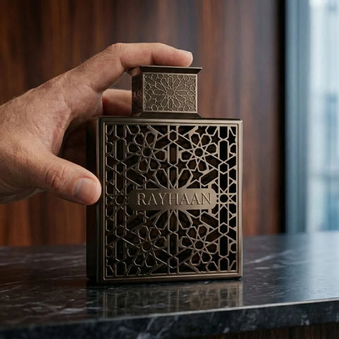 Rayhaan Obsidian Eau de Parfum spray 100ml, glass bottle with black and silver design, showcasing the sleek fragrance packaging.