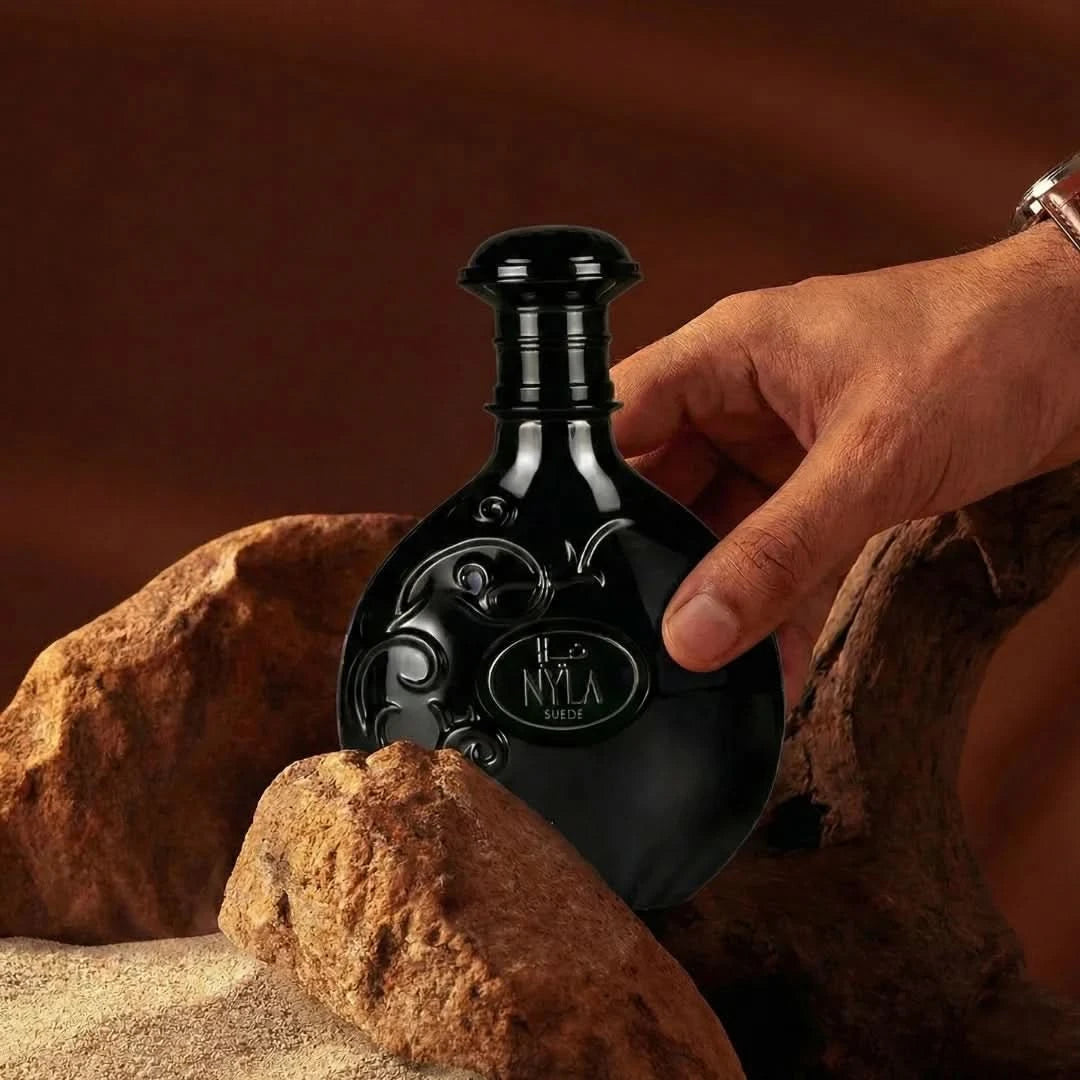 Arabiyat Prestige Nyla Suede Eau de Parfum spray 80ml, featuring elegant suede scent in a sleek bottle.