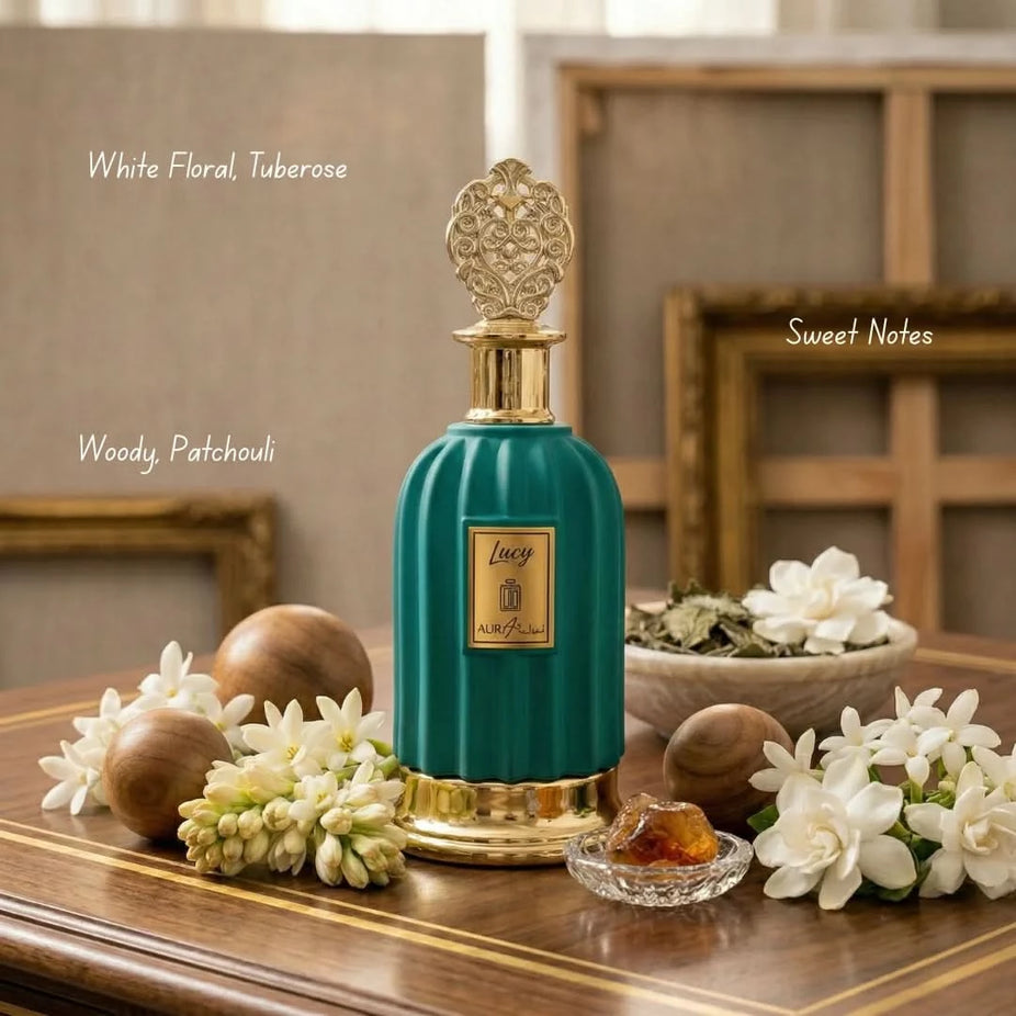 Bundle of Intense Oud Royal Musk Patchouli Apple and Aura Art Lucy Eau de Parfum sprays, 100ml each, with elegant bottle designs.