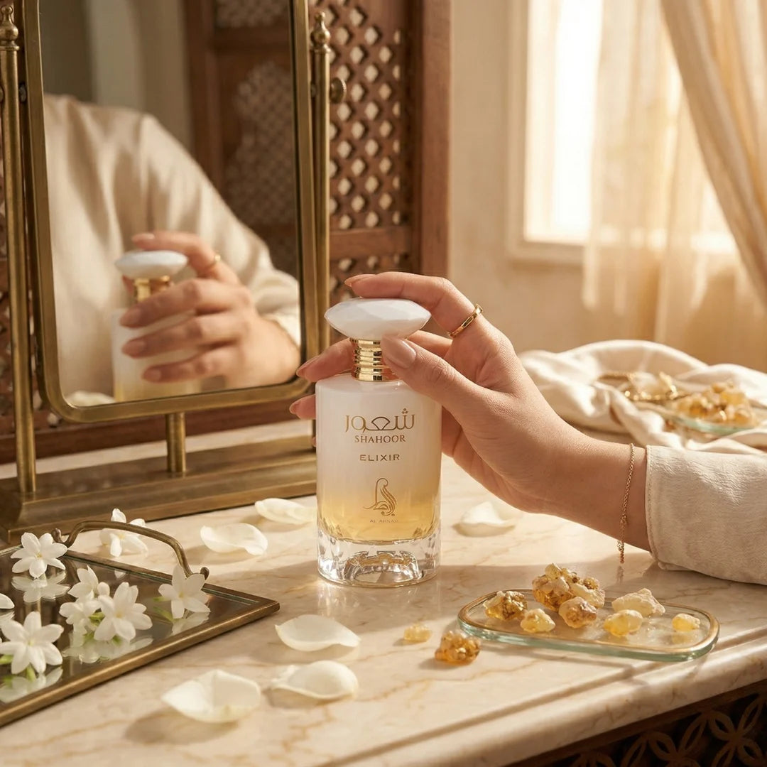 Al Absar Shahoor Elixir Eau de Parfum spray in a 100ml bottle, showcased in a velvet pouch with elegant packaging.