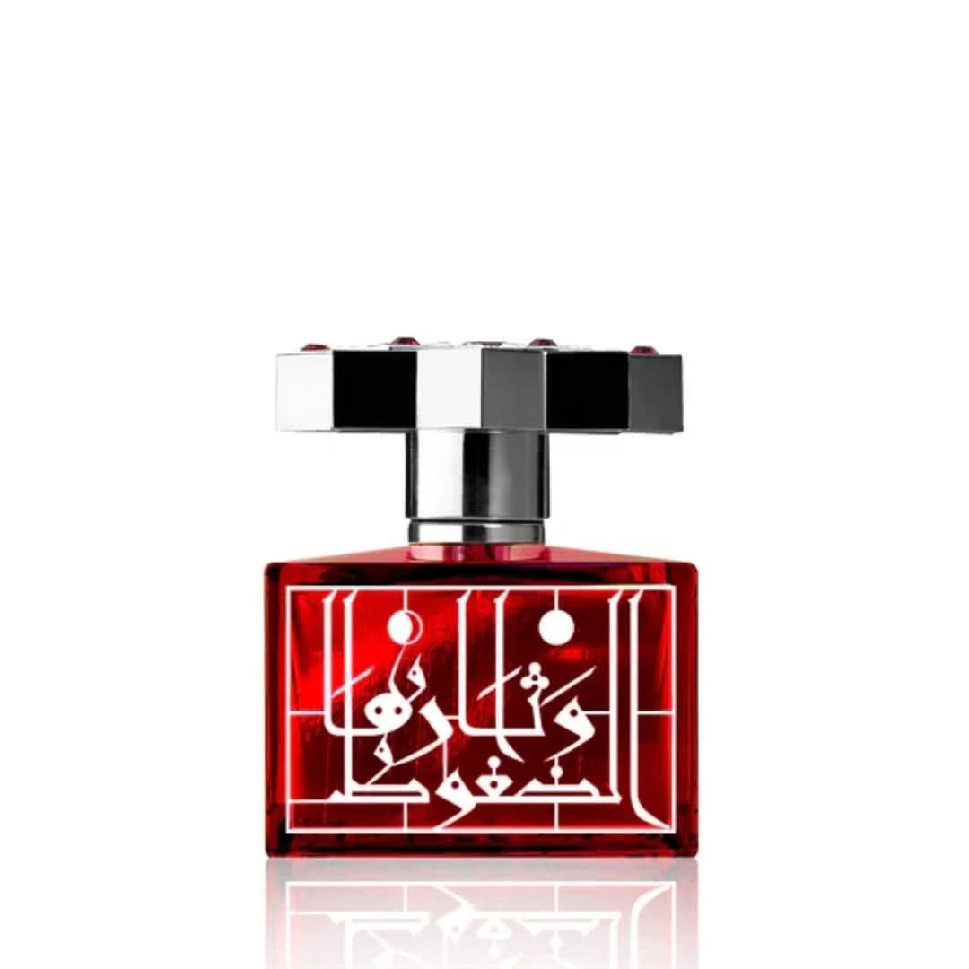 Kajal Ruby Eau de Parfum Spray 100ml, elegant glass bottle with ruby-red liquid, showcasing the luxurious fragrance.
