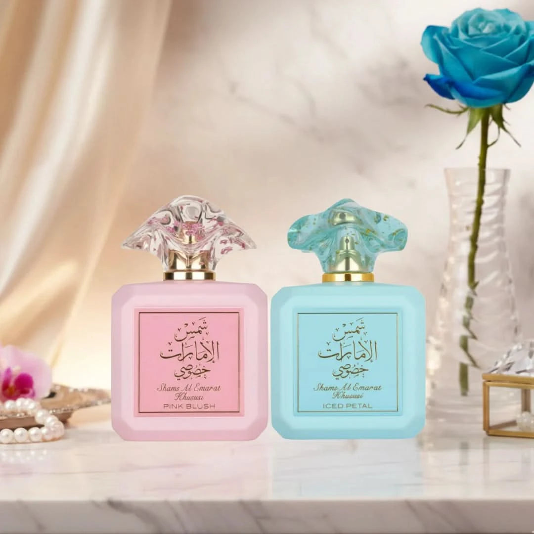 Bundle of Ard Al Zaafaran Shams Al Emarat Khususi Pink Blush and Iced Petal Eau de Parfum sprays in 100ml bottles, with pink and floral packaging.