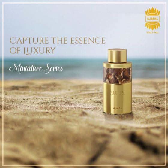 Set of seven Ajmal miniature perfume bottles in 10 ML sizes, arranged in a bundle, featuring various fragrances.