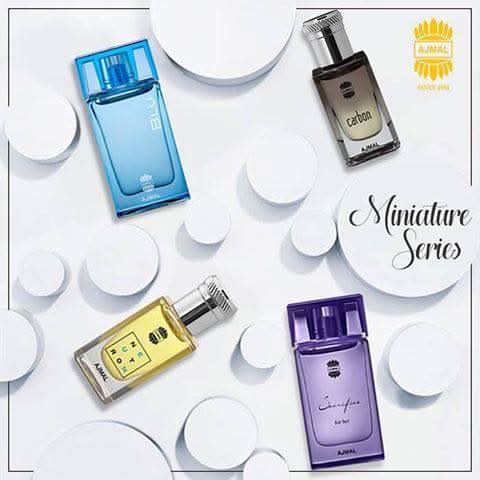 Set of seven miniature Ajmal perfume bottles, 10 ML each, featuring elegant packaging and branding in a compact bundle.