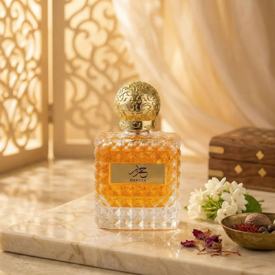Aura by Aura Hareer Eau De Parfum Spray 100ml, elegant glass bottle with floral and woody fragrance notes.