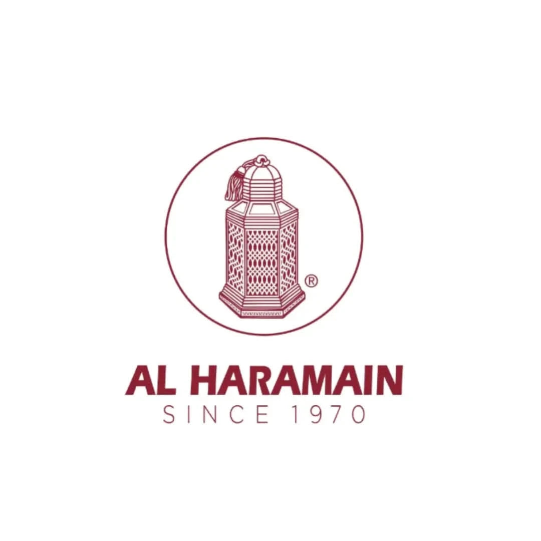 Al Haramain Amber Oud Aqua Dubai EDP spray in a 100ml bottle, displayed with a velvet pouch, showcasing luxurious fragrance packaging.
