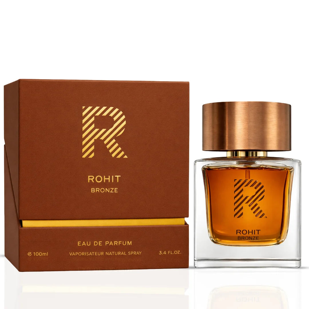 Rohit Bronze Eau de Parfum spray by Bharara, 100ml bottle, with golden cap and elegant design displayed in the image.