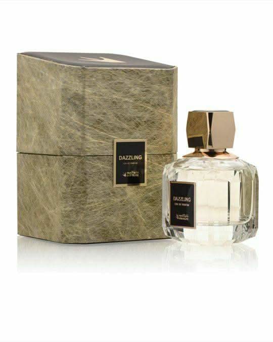 Oud Elite Dazzling Gold Eau de Parfum 100 ml – gold bottle on a sleek surface
