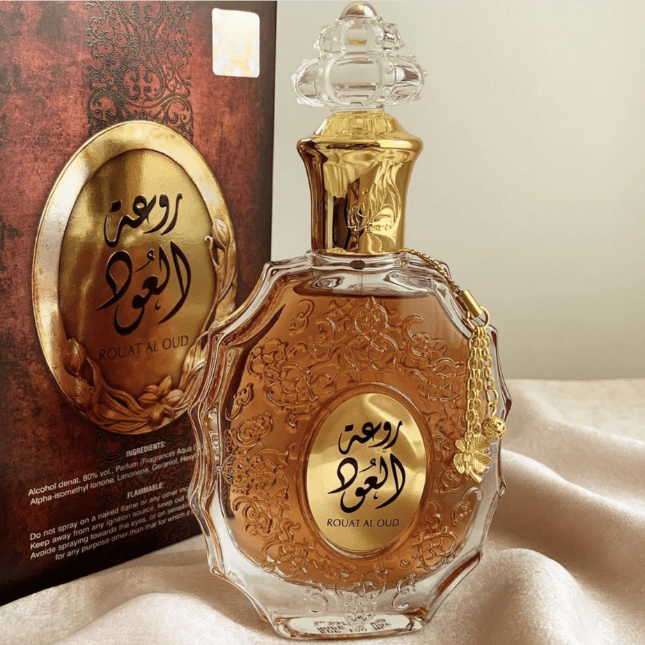 Rouat Al Oud Eau de Parfum Spray by Lattafa, 100ml bottle with elegant packaging and golden accents.