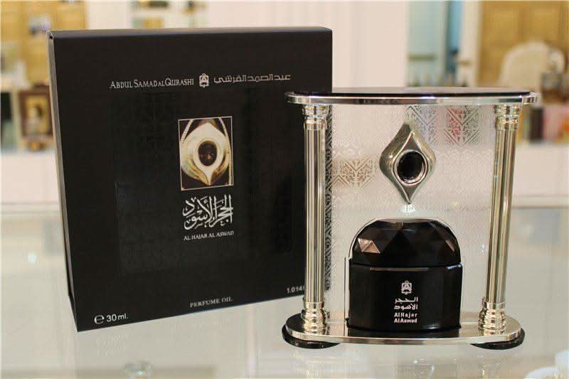Al Hajar Al Aswad perfume oil by Abdul Samad Al Qurashi in a 30ml CPO bottle, featuring dark, ornate packaging and elegant design.