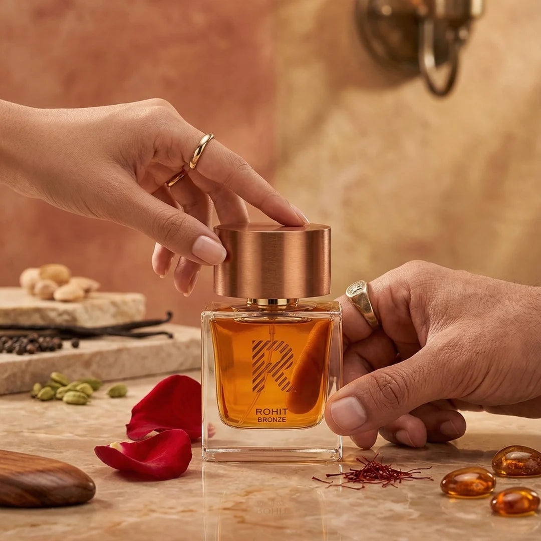 Rohit Bronze Eau de Parfum spray by Bharara, 100ml bottle, with elegant bronze-colored packaging and spray nozzle.