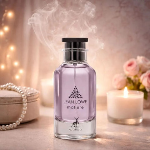 Maison Alhambra Jean Lowe Eau de Parfum spray in 100ml with a velvet pouch, featuring a sleek glass bottle and elegant design.