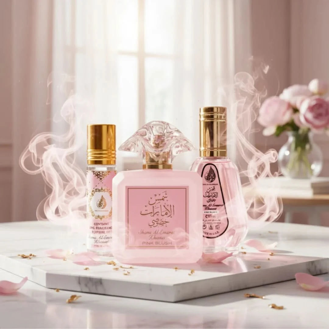 Bundle of Ard Al Zaafaran Pink Blush Shams Al Emarat perfumes including 100ml spray, 50ml spray, and 10ml roll-on perfume oil.